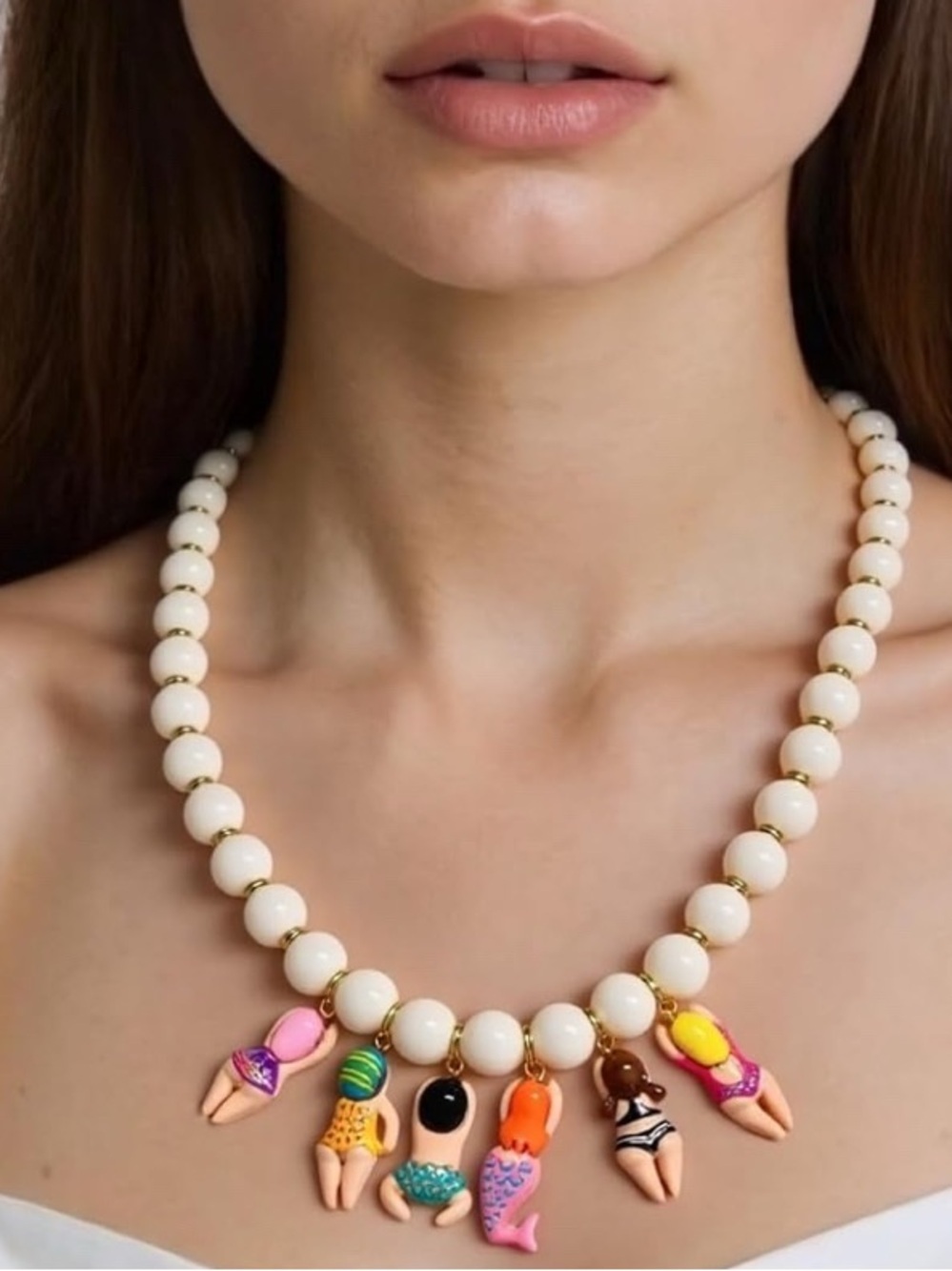 Anthropologie Cream Bead Necklace with Multicolor Swimmers Charms NWOT